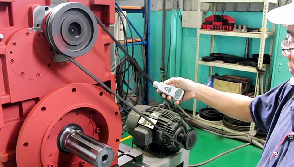 Technician testing a gearbox for all-electric injection molding machine by SUN LUNG GEAR
